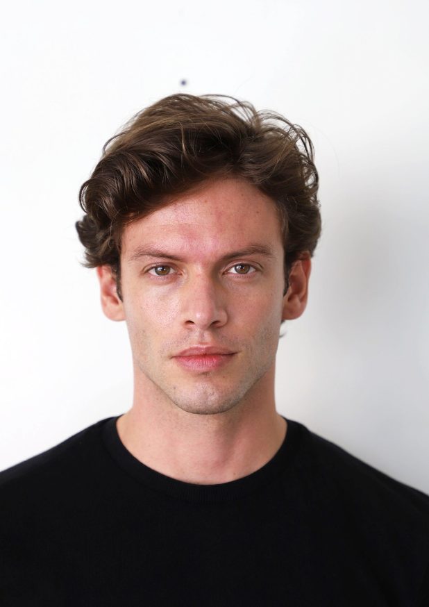 Example digital of a male model: natural light, plain background, no filters
